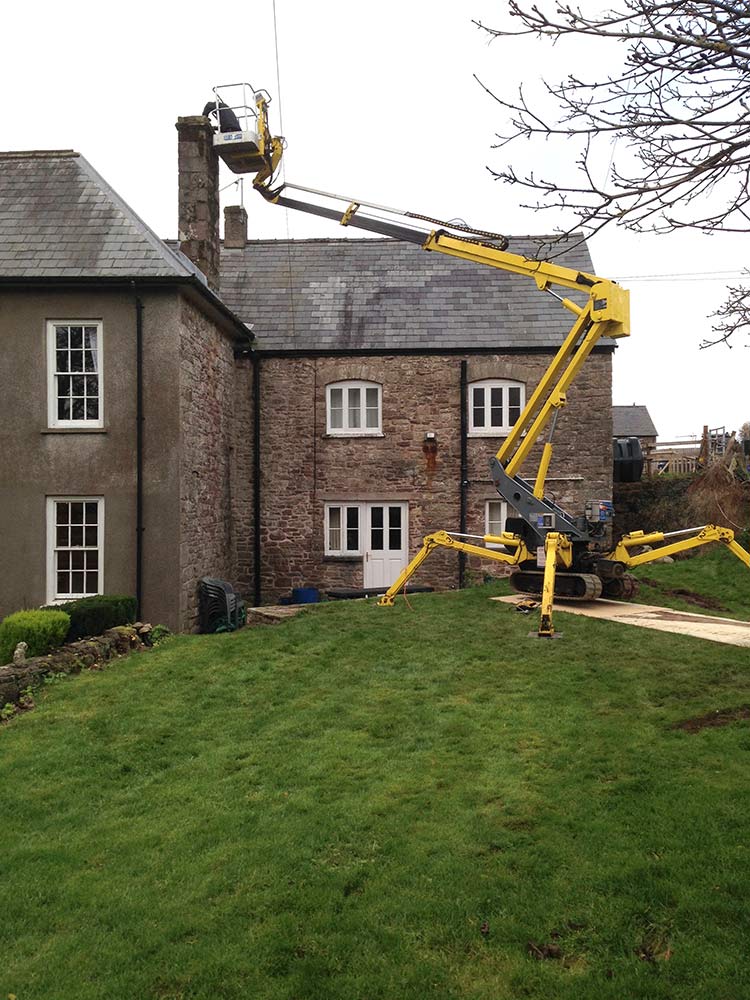 An image of Tracked access platform assisting the installation of a chimney liner saving hundreds of pounds in scaffolding hire goes here.